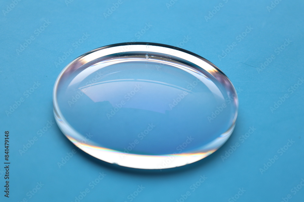 Poster glasses lens on blue table background