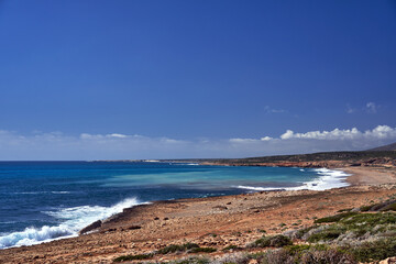 wild beach on the rocky coast of the mediterranean sea on the island of Cyprus