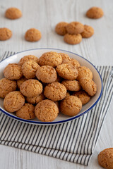 Homemade Sweet and Crunchy Amaretti on a Plate, side view.