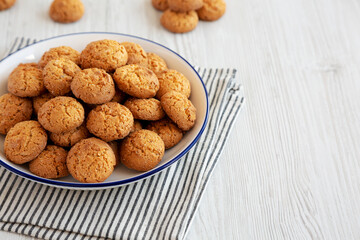 Homemade Sweet and Crunchy Amaretti on a Plate, side view. Copy space.