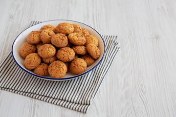 Homemade Sweet and Crunchy Amaretti on a Plate, side view. Copy space.
