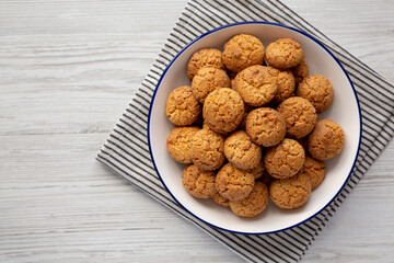 Homemade Sweet and Crunchy Amaretti on a Plate, top view. Flat lay, overhead, from above. Copy space.