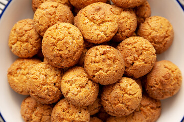 Homemade Sweet and Crunchy Amaretti on a Plate, top view. Flat lay, overhead, from above. Close-up.