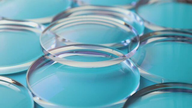 Eyeglass lens manufacturing industry, close-up of eyeglass lenses, eyeglass lenses, eyeglass glass lenses
