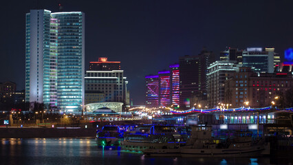 Fototapeta premium Buildings at New Arbat Street after sunset timelapse. New Arbat is located in the central part of Moscow