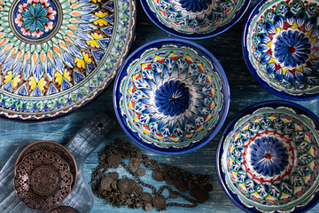 Asia ceramic tableware on blue background.  ceramic cups with traditional ornament