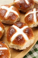 Tasty hot cross buns on table, closeup