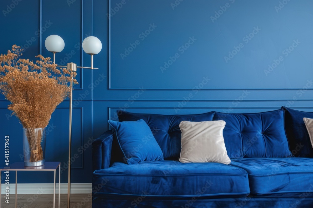 Canvas Prints Chic blue living room featuring a luxurious velvet couch and modern decor accents