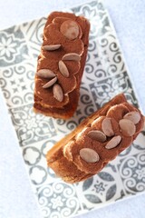 Supreme croissants with chocolate chips and cream on grey table, top view. Tasty puff pastry