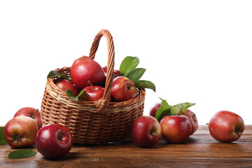 Ripe red apples and leaves on wooden table against white background