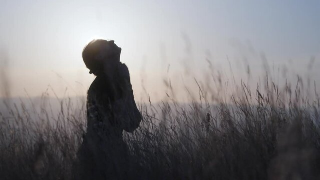 Crying and desperate woman lamenting in nature, begging for mercy