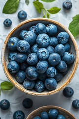 Blueberries Being Poured from Bowl.