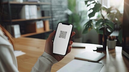 A Modern Office Worker Scans a QR Code
