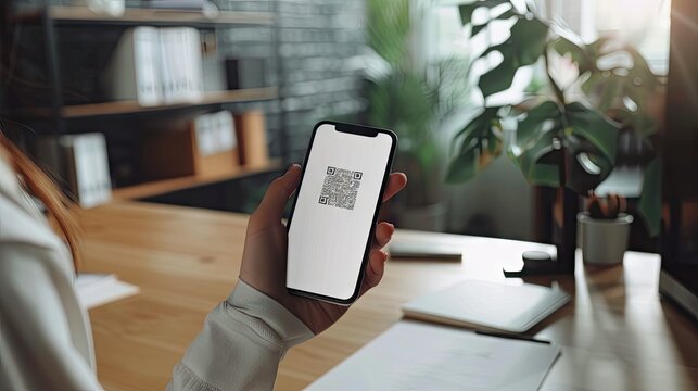 A Modern Office Worker Scans a QR Code