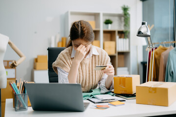 Young Asian owner woman prepare parcel box  woman is stressed, bored, and overthinking from working