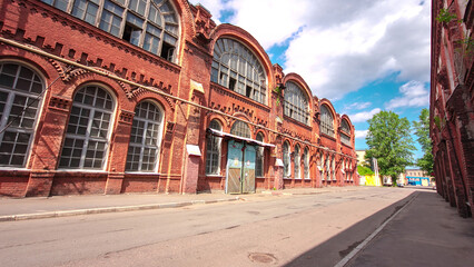 Fototapeta premium The old factory bricks building with windows and gates timelapse hyperlapse