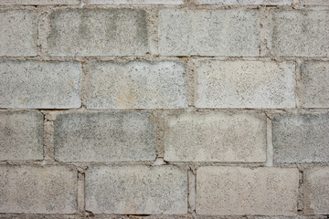 Seamless old stone brick wall background texture. Tileable antique vintage stone blocks or tiles surface pattern. Rustic cottagecore wallpaper or backdrop.