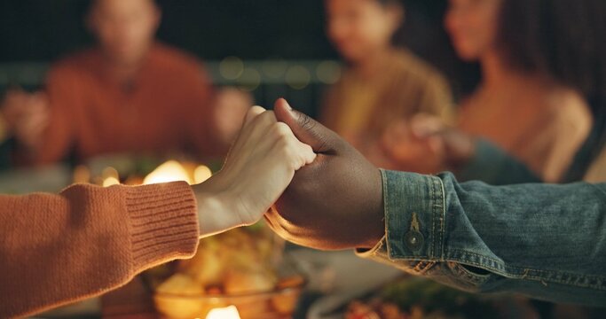 Closeup, holding hands and praying, food and friends worship together, gratitude and thanks to God at dinner party. Men, women with nutrition and religion, celebration and social event at night