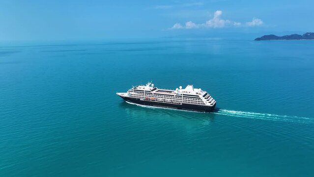 Cruise ship sailing across The Mediterranean sea - Aerial footage. Luxury cruise in the ocean sea concept tourism travel on holiday take a vacation time on summer. 