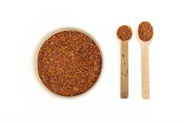 Dry chia seeds in a plate and wooden spoons