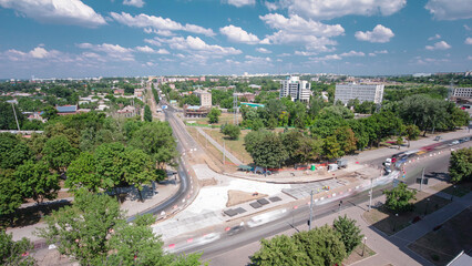 Road construction site with tram tracks repair and maintenance aerial timelapse.