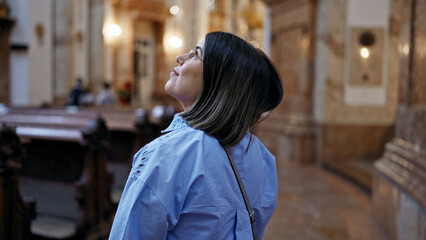 Young beautiful hispanic woman visiting church at St. Karl BorromÃ¤us church