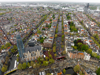 Kings Day 2024 in Amsterdam. Koningsdag, Koeningsdag in Capital of the Netherlands, Aerial Drone Fly Over Orange Suits.