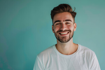 A close up portrait of a young man with a subtle smile
