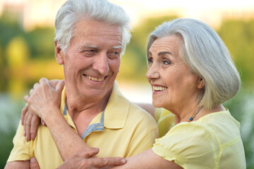 Loving mature couple in the park in summer