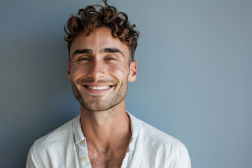 Obraz premium A close up portrait of a young man with a subtle smile
