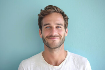 Obraz premium A close up portrait of a young man with a subtle smile