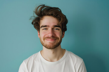Obraz premium A close up portrait of a young man with a subtle smile