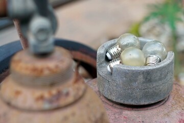 Close-Up a three vintage light bulb on old metal.