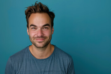 Fototapeta premium A close up portrait of a young man with a subtle smile