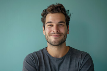 Fototapeta premium A close up portrait of a young man with a subtle smile