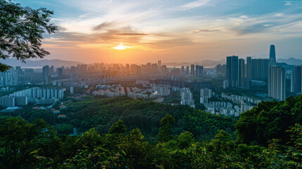 Panoramic view of Shenzhen cityscape with sunset and green landscape
