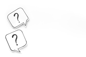 Question marks on paper speech bubbles. FAQ concept or search information concept