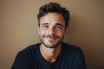 Fototapeta premium A close up portrait of a young man with a subtle smile