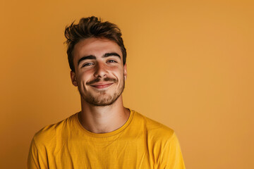 Fototapeta premium A close up portrait of a young man with a subtle smile