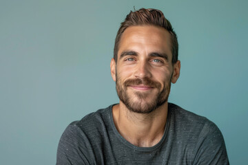 Obraz premium A close up portrait of a young man with a subtle smile