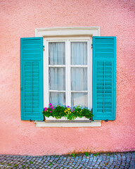 open window with green wooden shutters, pink texture wall