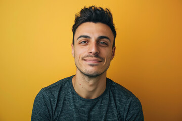 Obraz premium A close up portrait of a young man with a subtle smile