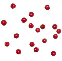 Red peppercorns scattered on isolated background,