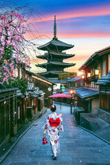 Asian woman wearing japanese traditional kimono at Yasaka Pagoda and Sannen Zaka Street in Kyoto, Japan.