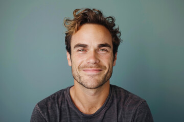 Obraz premium A close up portrait of a young man with a subtle smile