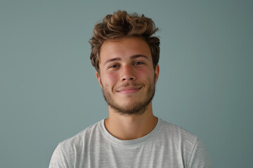 Obraz premium A close up portrait of a young man with a subtle smile