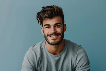 Fototapeta premium A close up portrait of a young man with a subtle smile