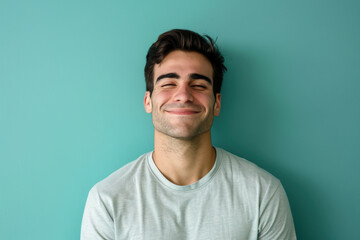 Obraz premium A close up portrait of a young man with a subtle smile