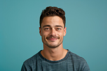 Fototapeta premium A close up portrait of a young man with a subtle smile