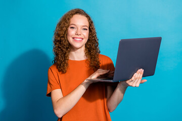 Photo of positive girl use hold netbook look isolated blue color background